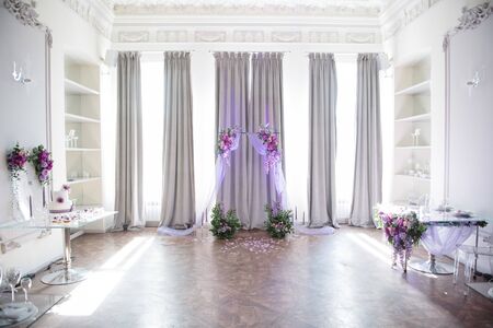 Festive and solemn decoration of the banquet room on the wedding dayの写真素材