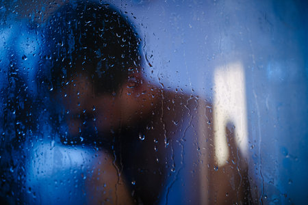 Man and woman naked together in the shower close upの写真素材