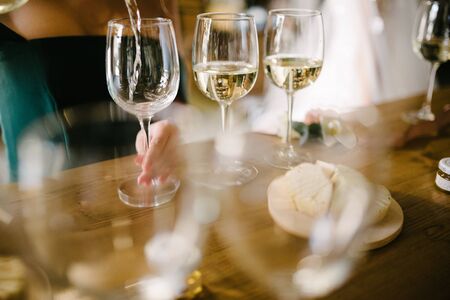 Man pours champagne into a glassの写真素材