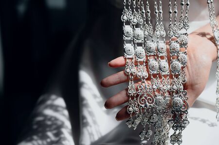 expensive necklace on the neck of a young woman close-up. Necklace of precious metals on the neck of a young womanの写真素材
