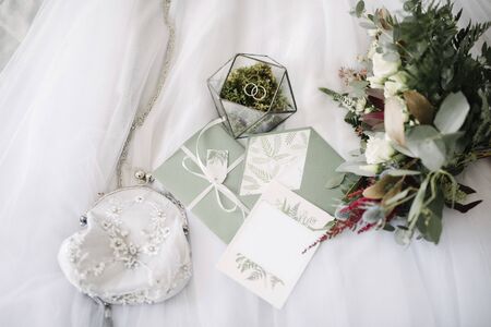 Women's accessories bride. Handbag, shoes, rings, bridal perfume close upの写真素材