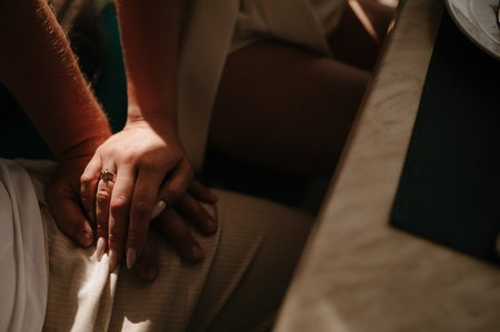 Man and woman hold hands close up. Hands of man and woman close up.