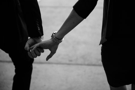 Man and woman hold hands