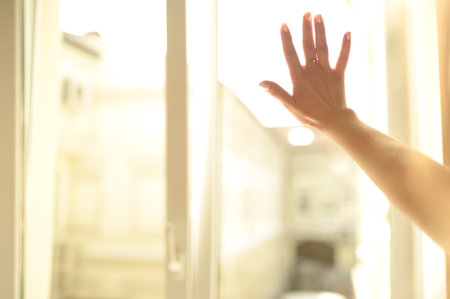 Male and female Hands on a misted window close up. Hand on a misted window