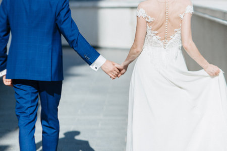 Man and woman hold hands