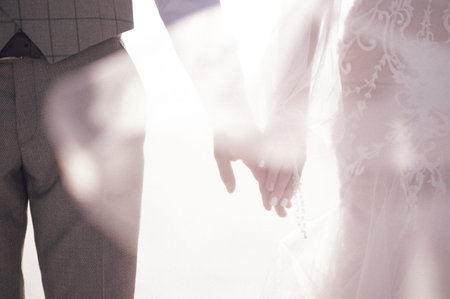 Man and woman hold hands close up. Hands of man and woman close up.