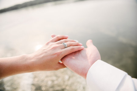 Man and woman hold hands close up. Hands of man and woman close up.