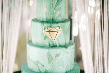 Large green wedding cake close-up on the wedding table close upの写真素材