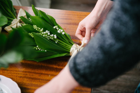 Florist's table with flowers. Florist makes flowers on the photo