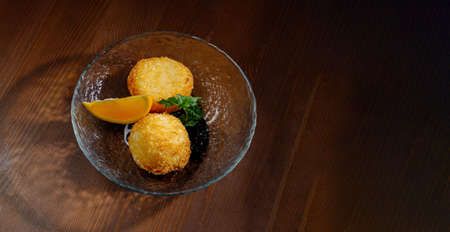 Potato croquettes - mashed potatoes balls breaded and deep fried, served with different sauce.Top viewの写真素材