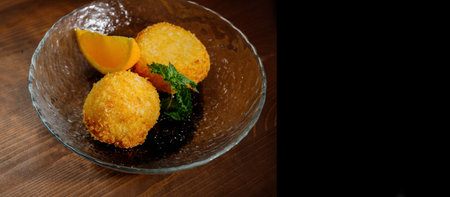 Potato croquettes - mashed potatoes balls breaded and deep fried, served with different sauce.Top...