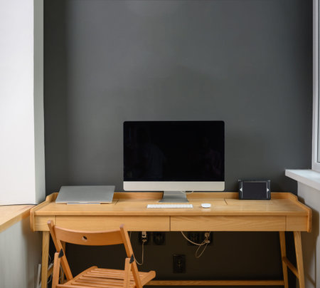 Photographer's workplace with professional camera and computer.Workplace with computer, laptop and...