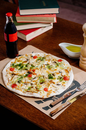 pizza with chicken, mozzarella, olives and basil top view with copy space.Pizza with chicken and...