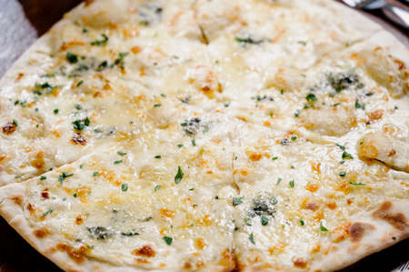 Flatbread with greens and herbs. Traditional caucasus and Turkish bread. Asian flatbreads with cheese and herbs.Khychiny - traditional caucasian flatbread filled with cheese and herbs.の写真素材