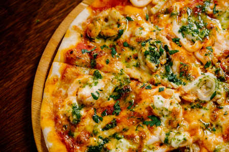 Delicious Shrimp pizza on wood table.Pizza with shrimp, salmon Top viewの写真素材