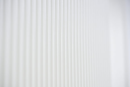 Wooden door with a modern locking mechanism and a wall switch is shown in a well-lit indoor setting, emphasizing contemporary design elementsの写真素材