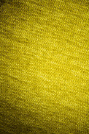 Grunge yellow drape with a gradient of light.の写真素材