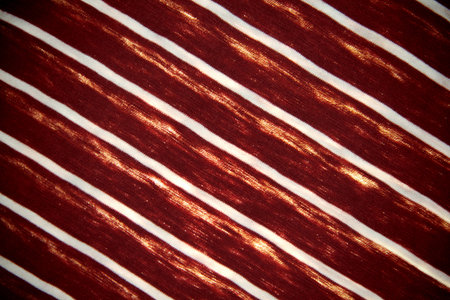 Grunge striped drape with a gradient of light.