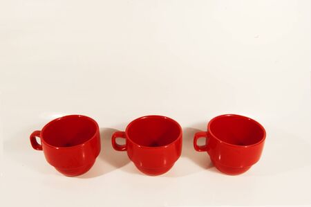 Set of three red coffee cupsの写真素材