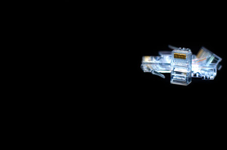 RJ45 Plug or Network cable, Close up on black background