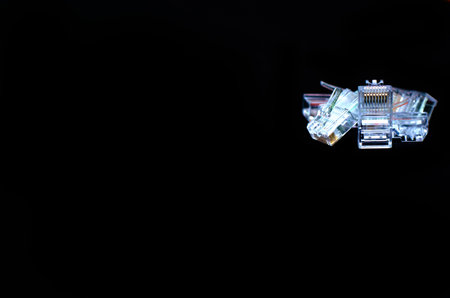RJ45 Plug or Network cable, Close up on black background