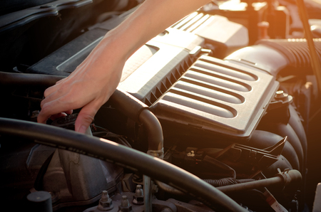Asian woman's hand checking car engineの写真素材