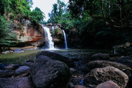 Haew Suwat boasts breathtaking streams of water freefalling over a roughly 20-metre-high ledge into a circular pool.の写真素材