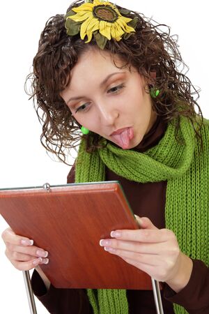 Black hair girl showing tongue is isolated on a white backgroundの写真素材