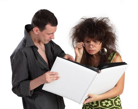 guy and the girl look the book isolated on a white background の写真素材