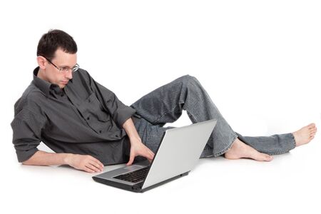 guy with the laptop isolated on a white background の写真素材