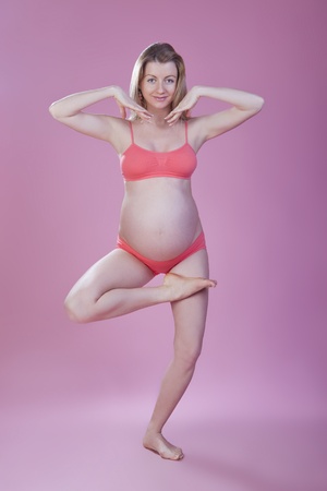 pregnant woman is engaged in gymnasticsの写真素材