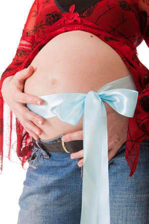 a belly of pregnant woman isolated on a white backgroundの写真素材