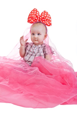 Portrait of sitting little girl isolated on whiteの写真素材