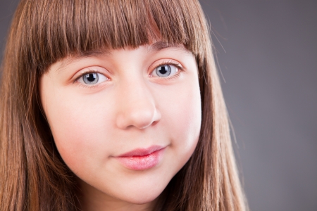 Portrait of beautiful young girl in studioの写真素材