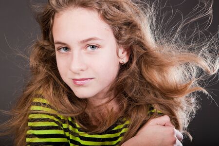 Portrait of beautiful young girl in studioの写真素材