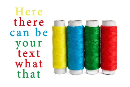 Few bobbins isolated on whiteの写真素材