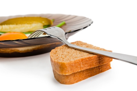 One fried eggs with slices of wholegrain toastの写真素材