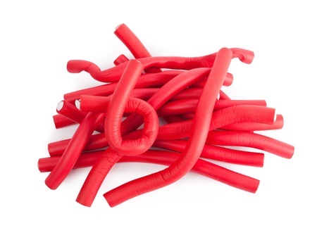 Red hair curlers isolated on a white backgroundの写真素材