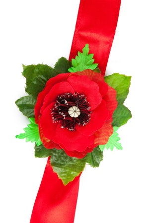 Red tape with a poppy from a fabricの写真素材