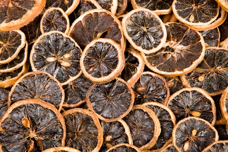 Slices of a dried lemon and slice of a fresh lemonの写真素材