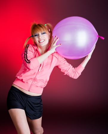 girl with balloon in studioの写真素材