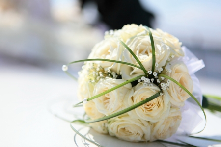 The beautiful bouquet of the bride executed from light beige rosesの写真素材