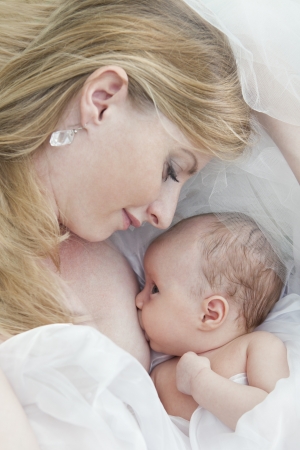 Mother breast feeding her infantの写真素材