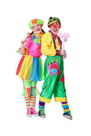 two clowns with a balloon in a hand isolated on a white backgroundの写真素材