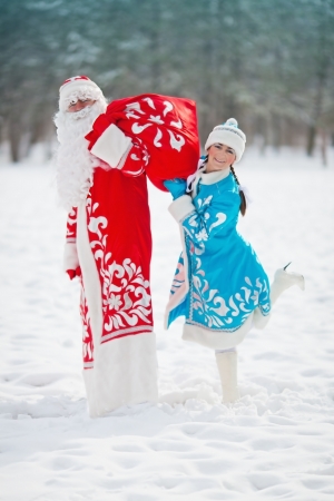 Russian Christmas characters  Ded Moroz  Father Frost  and Snegurochka  Snow Maiden  with gifts bagの写真素材