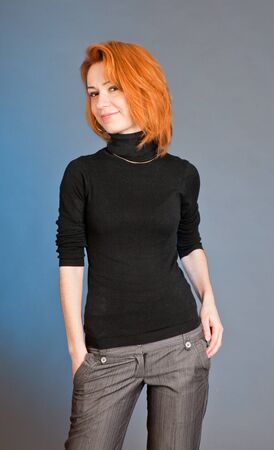 Portrait of the beautiful harmonous girl with red hairの写真素材