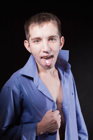 Young handsome man taking a pillの写真素材