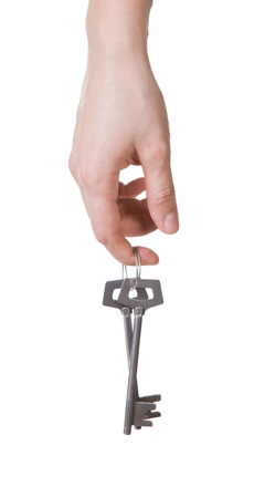 Hand and keys isolated on white background の写真素材