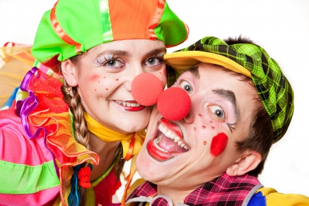 Two clown smiling isolated over a white background の写真素材