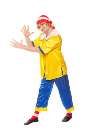 The cheerful clown in a pinocchio suit, isolated on a white backgroundの写真素材
